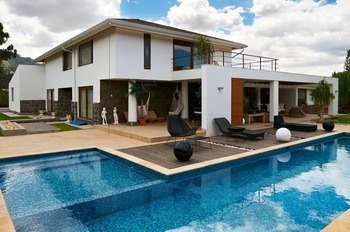 image of a custom home next to a pool